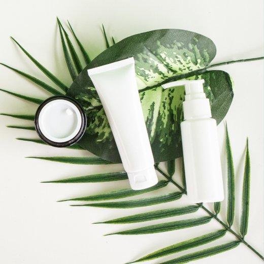 Skin Care Products with green leaves Skin Care Products with green leaves