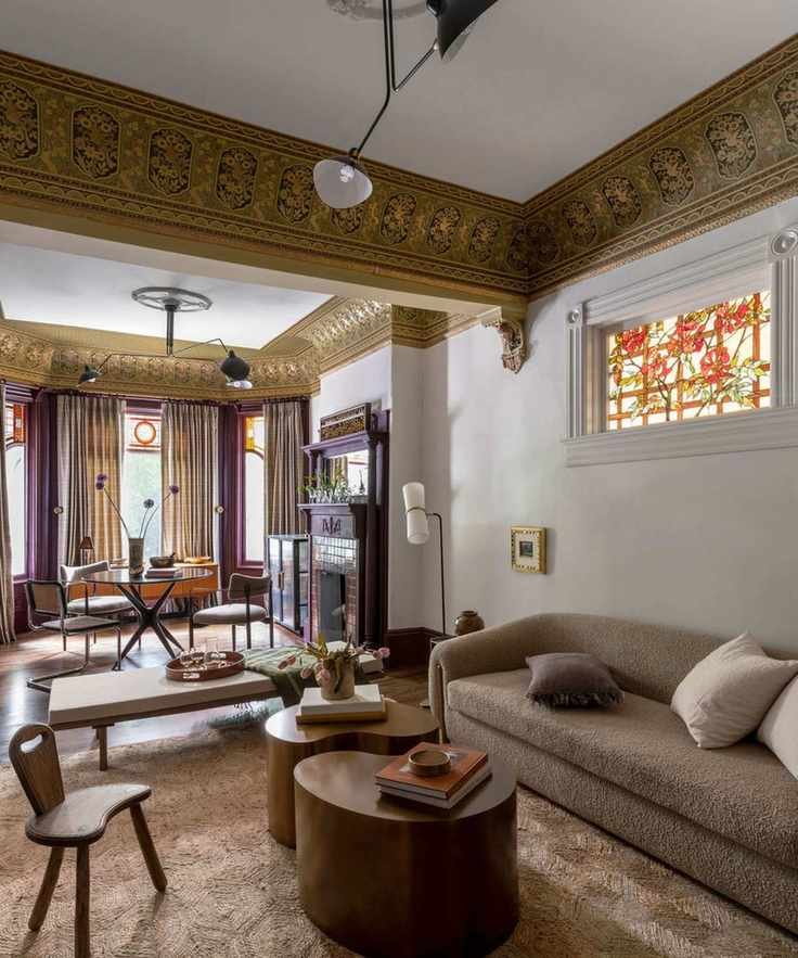 Open plan living room with brown couch and purple accents