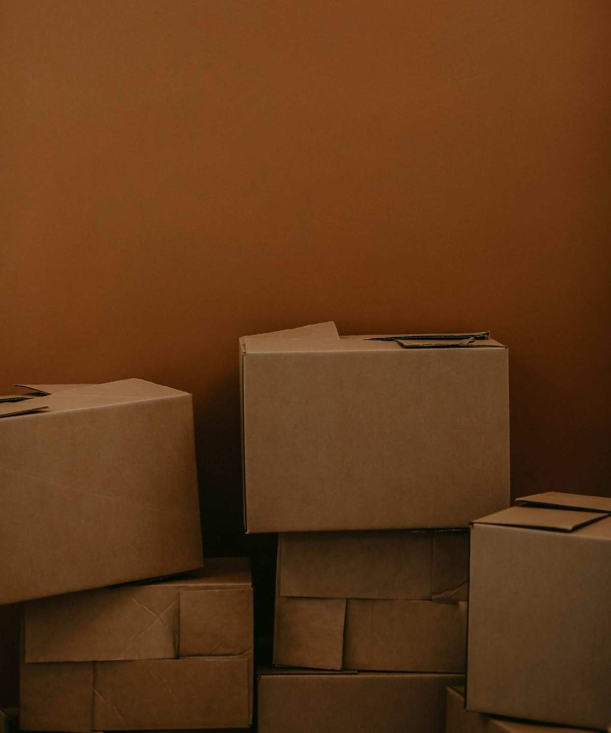 Moving boxes against a wall