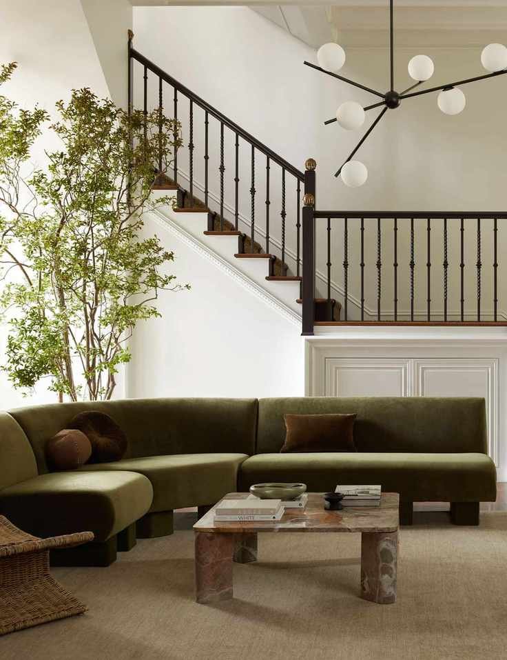 Lulu and Georgia living room with green sofa, marble coffee table