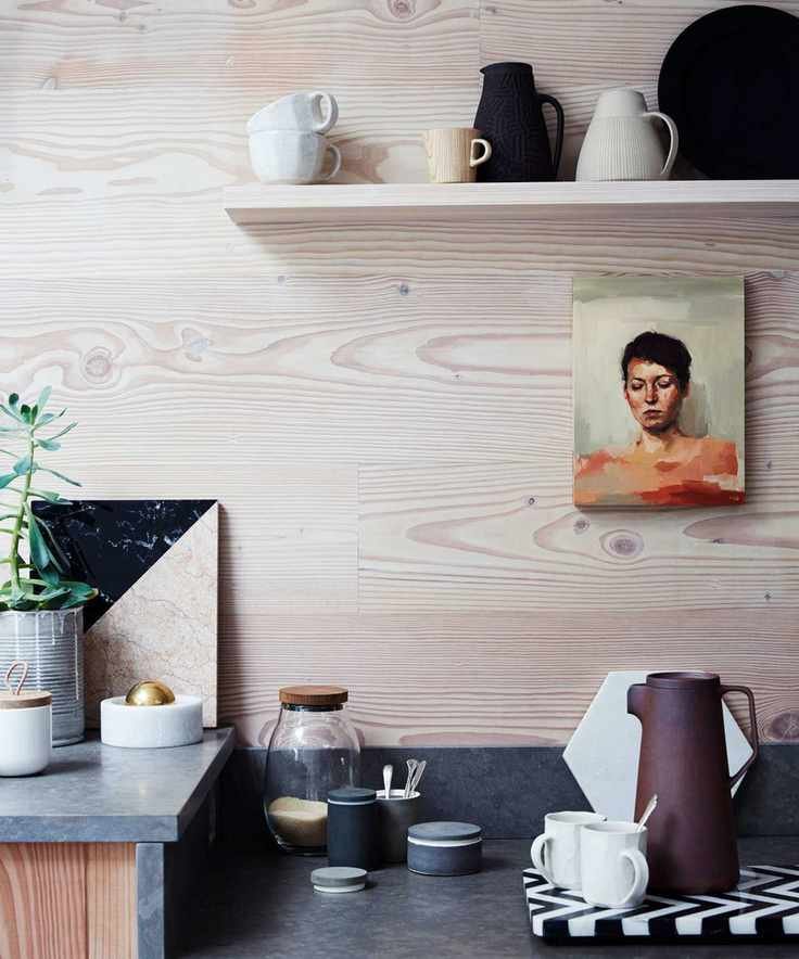stone kitchen worktop with shelf above for ceramics and kitchen storage jars