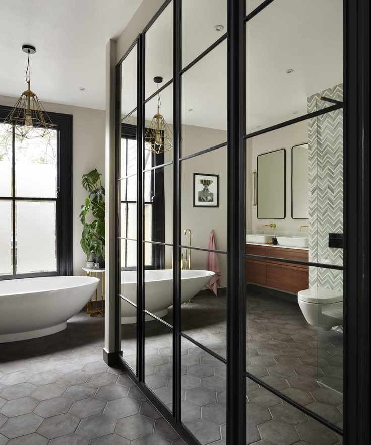 A large bathroom with mirrored storage cabinet