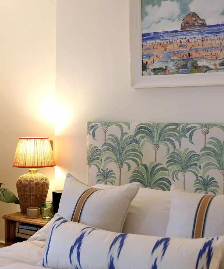 Bedroom with white walls and warm lighting
