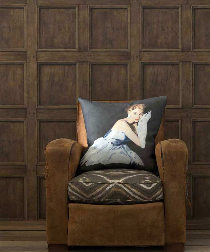 Panelling ideas for walls with dark wood panelling and leather armchair