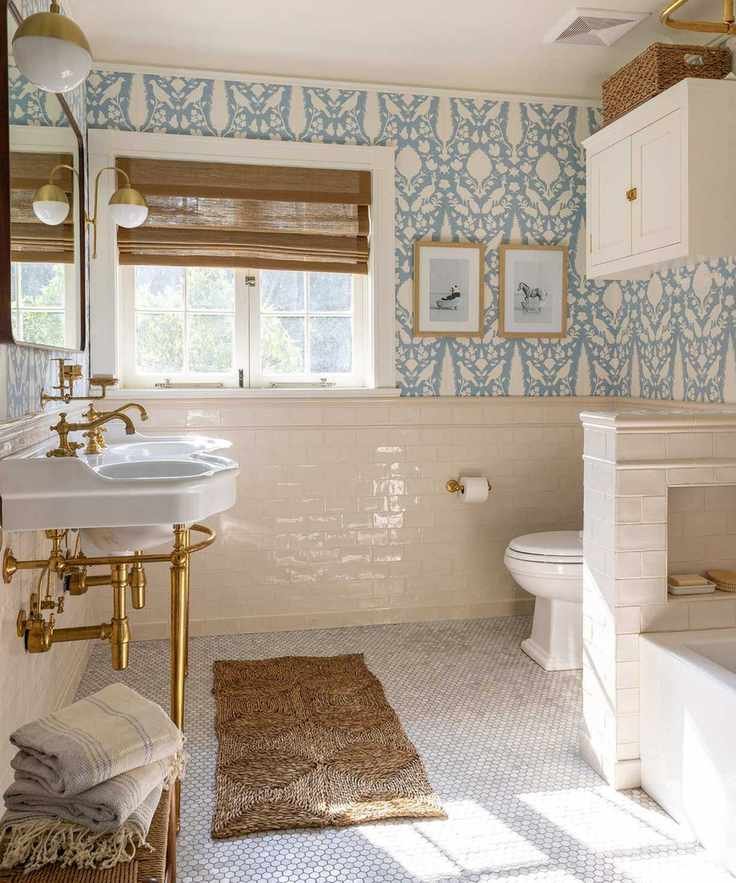neutral coastal bathroom with blue patterned wallpaper