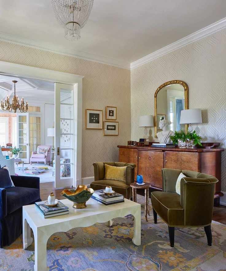 A living room with an antique dresser and seating