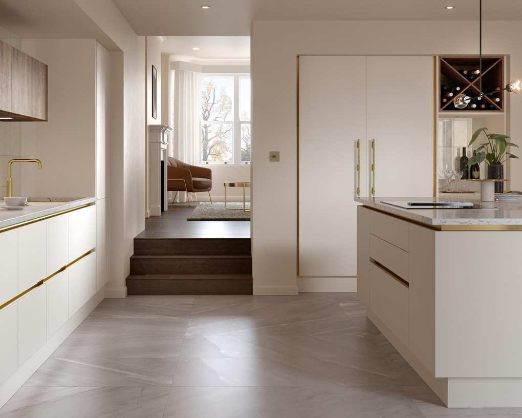 Chic white kitchen featuring brass accents