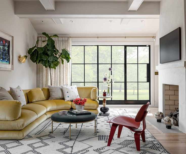 Modern living room with yellow velvet couch
