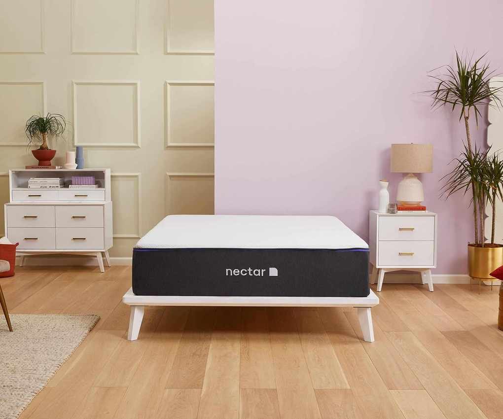 Nectar Memory Foam Mattress against a green and pink wall.