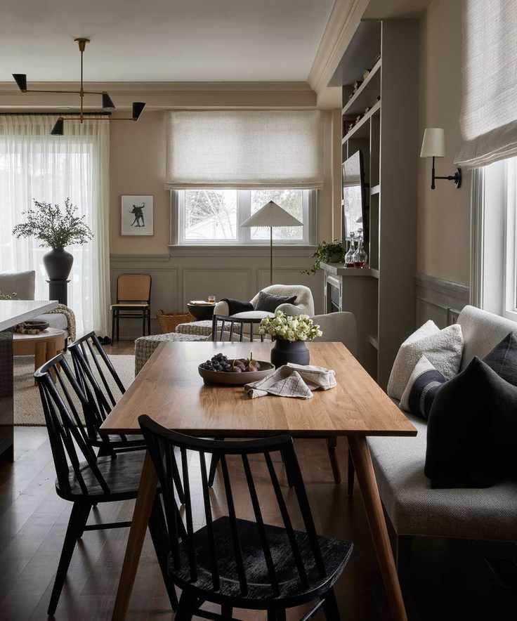 Black wooden chairs, white and black cushions