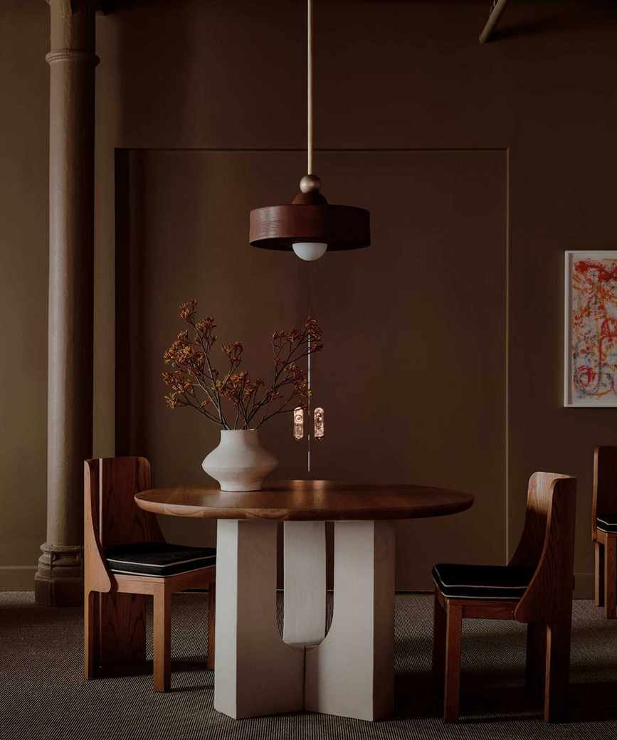 Brown dining room with wooden table and chairs