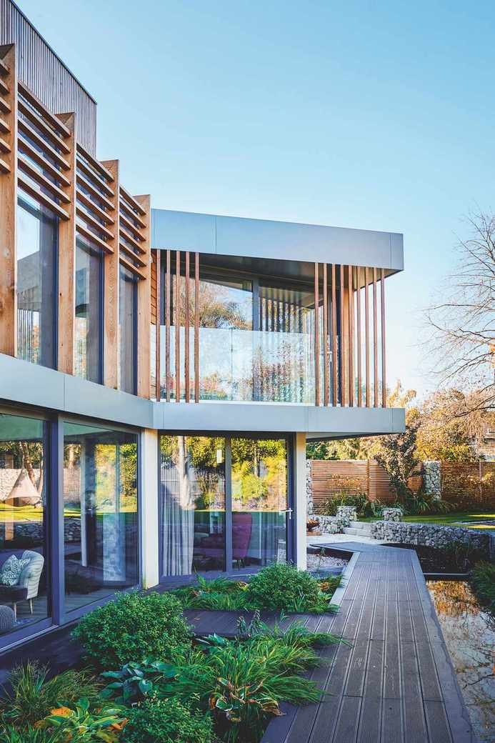 landscaping in the backyard of a modern home to complement the architecture