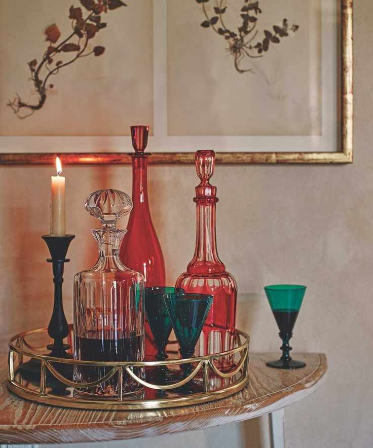 Vintage colored glassware on a gold mirrored tray
