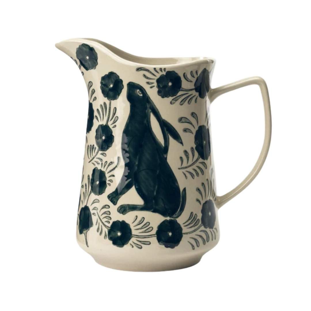 a pitcher with a rabbit on it