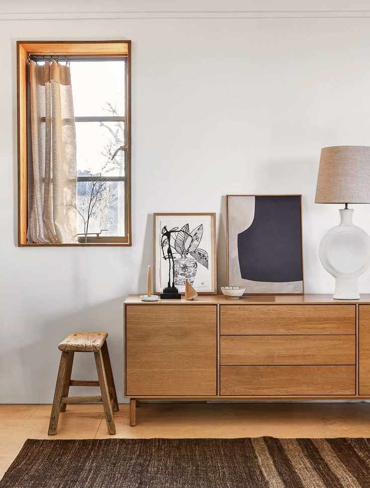 Art leaning on a sideboard