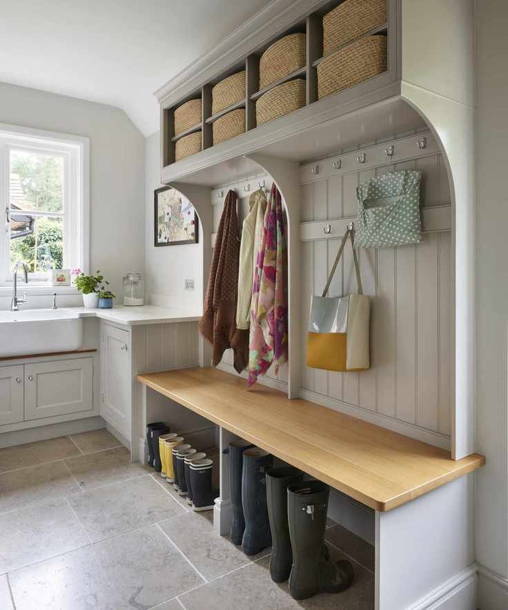 Laundry room styled as a boot room with dedicated space for footwear and outerwear.