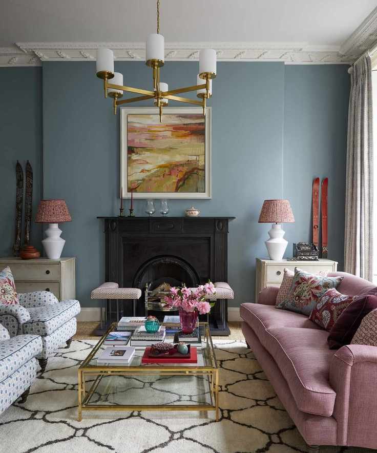 Main living room with blue walls and pink sofa in Edinburgh Georgian townhouse designed by Jessica Buckley