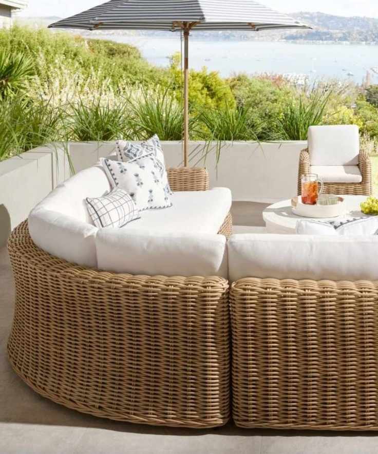 Outdoor living room with woven seating and soft planting