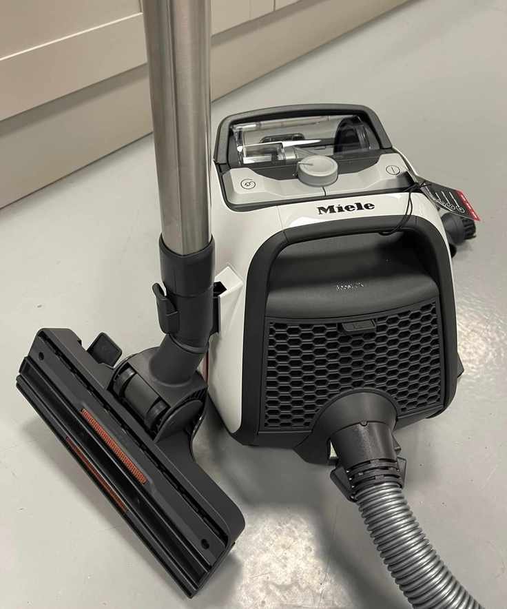 Miele Boost CX1 canister vacuum on concrete floor