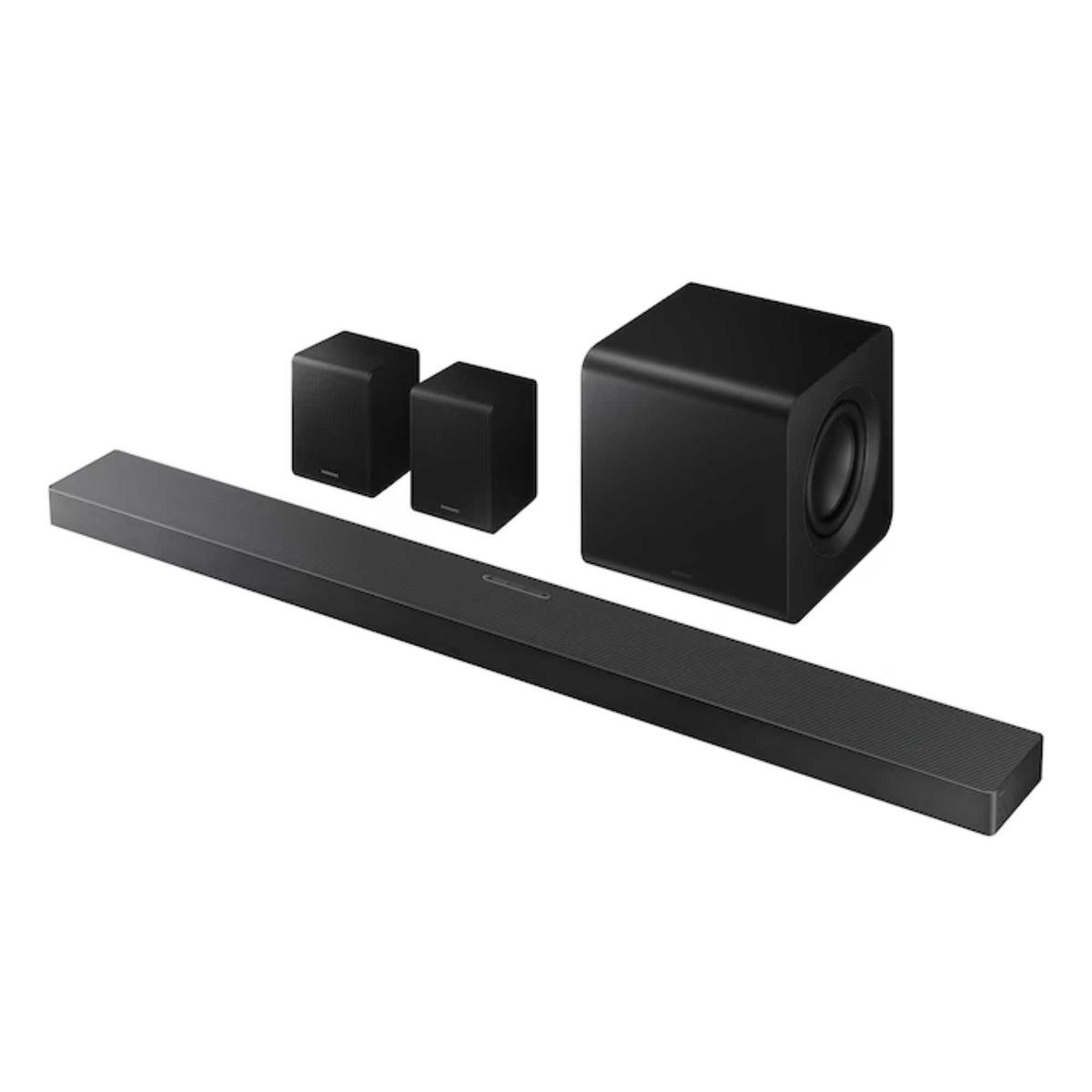Samsung HW-QS750F soundbar, woofer and two surround speakers against white background.