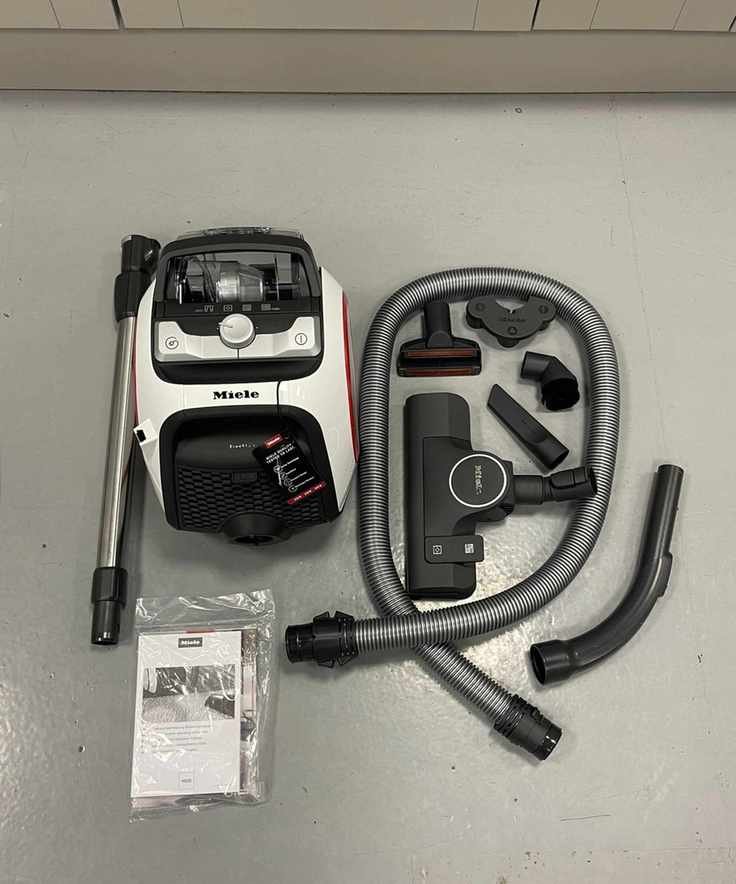 Miele Boost CX1 canister vacuum all parts and attachments on concrete floor
