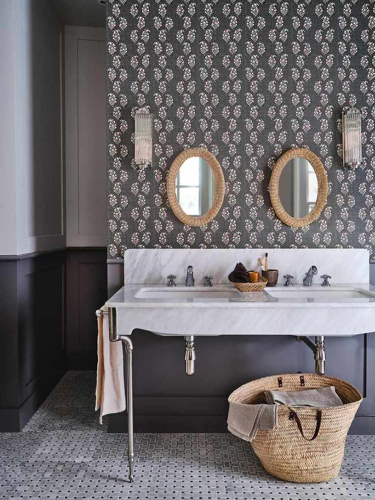 Bathroom with patterned wallpaper and double sink