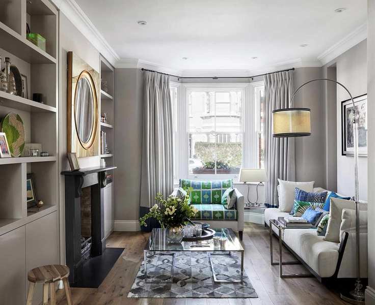 A small living room with grey walls