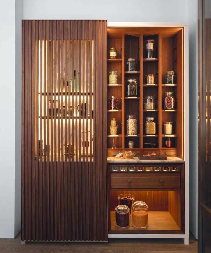 Large larder with sleek fluted wooden door