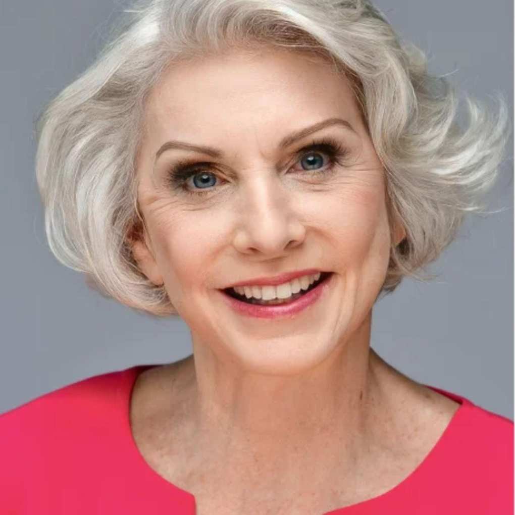 barabara brock in a pink shirt on a gray background