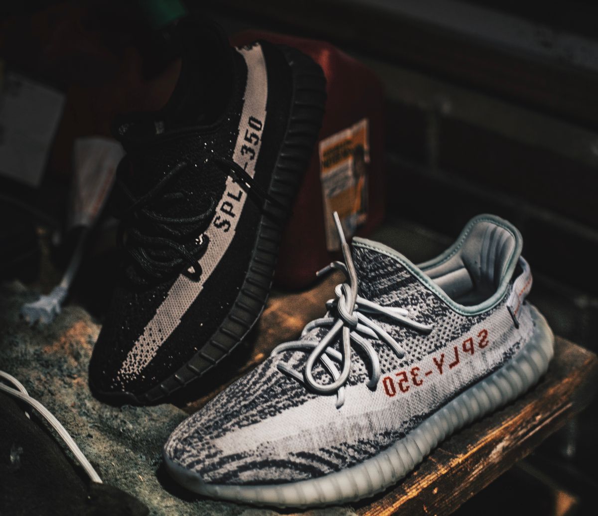 Adidas Boost knit sneakers in black and zebra colorways