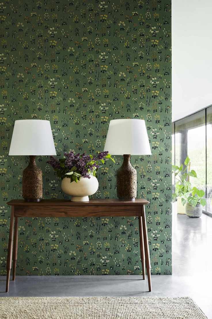 Green wallpaper with small patches of flowers