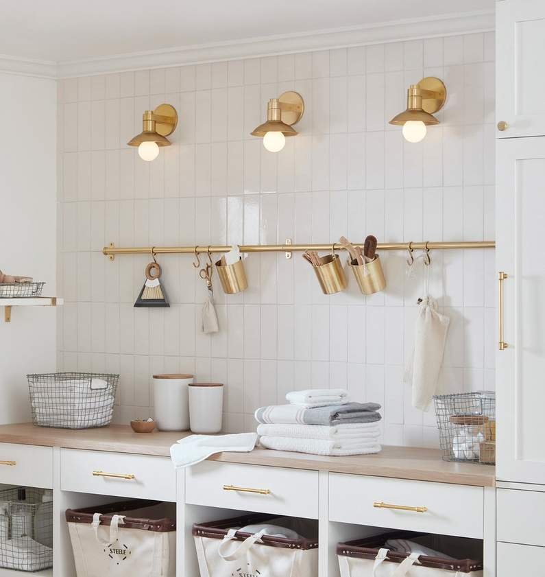 laundry room with brass storage rail