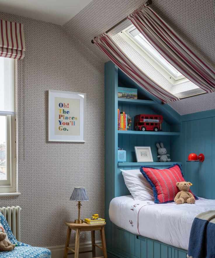 a child's bedroom with a built-in bed, red patterned wallpaper, and striped curtains hanging in front of the skylight