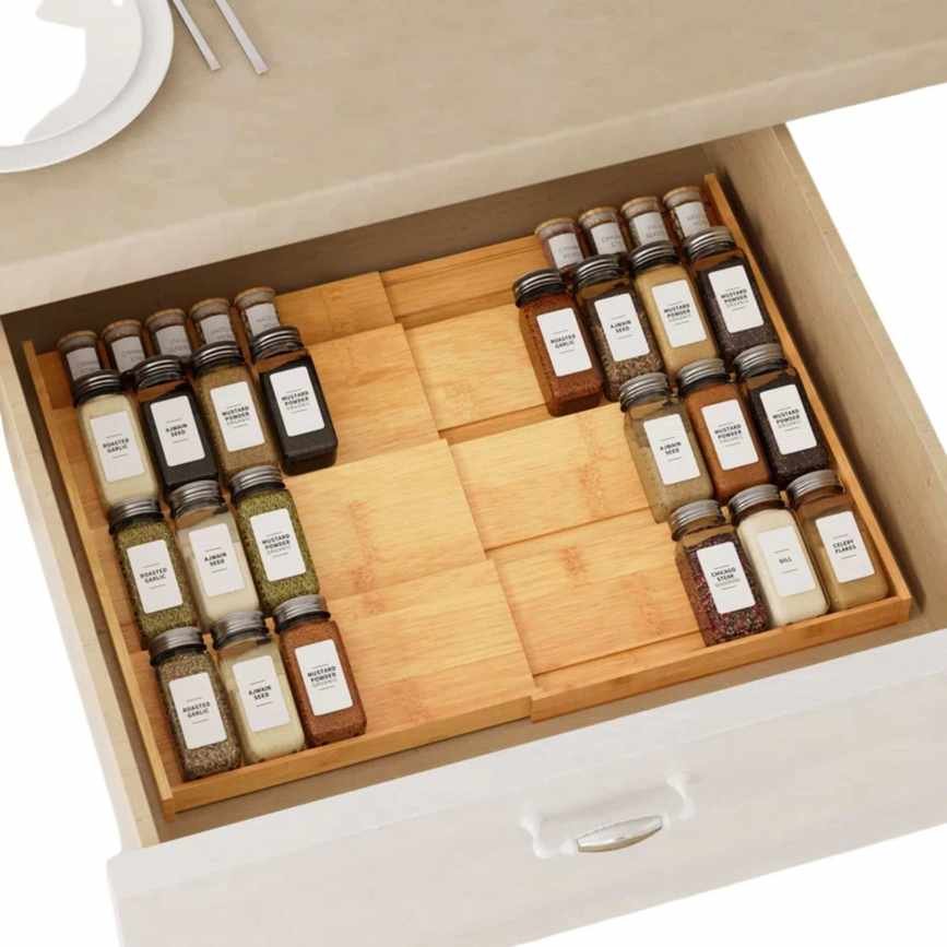 A wooden spice rack in a drawer