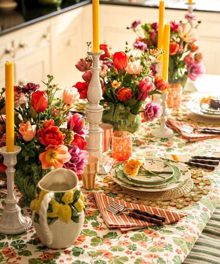 A high-angle view of a festive spring table set with vibrant tulip centerpieces