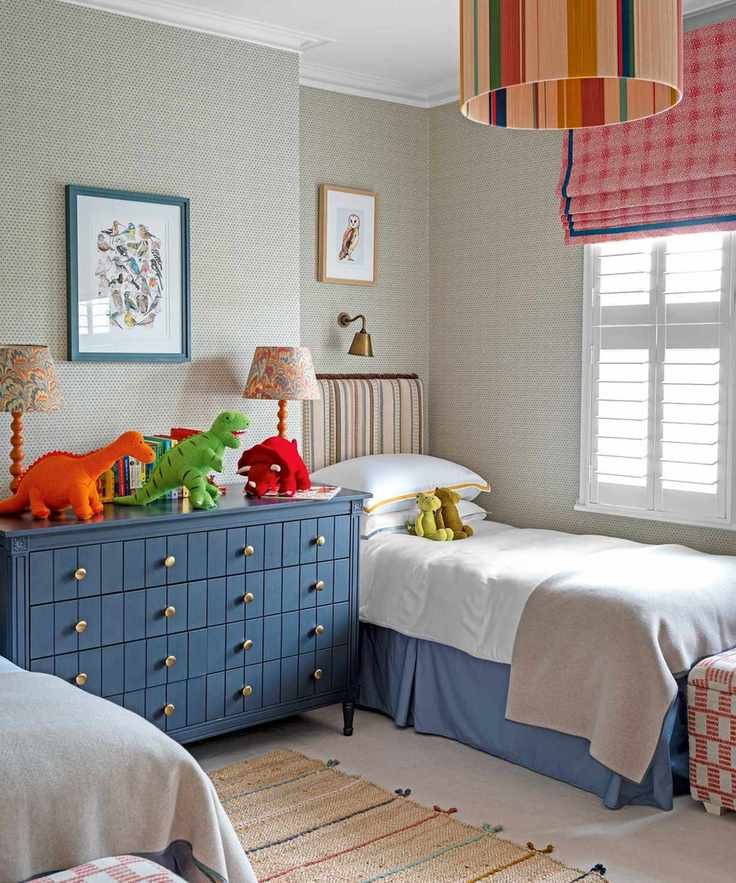 kids room with two beds and cuddly toys