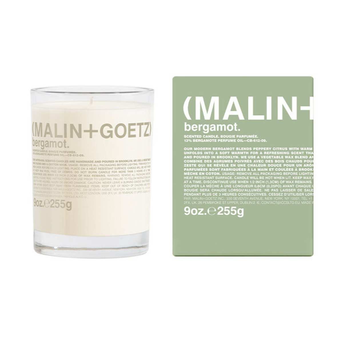 Malin + Goetz bergamot candle beside a light green cardboard box