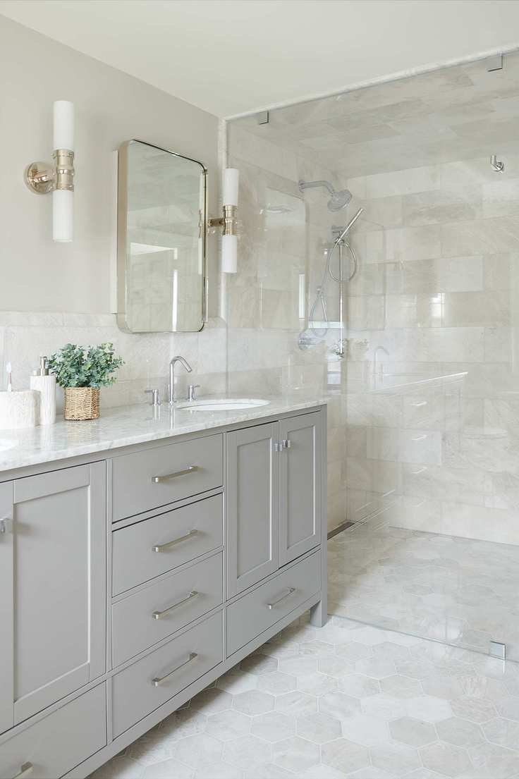 Tiled bathroom featuring a grey vanity unit