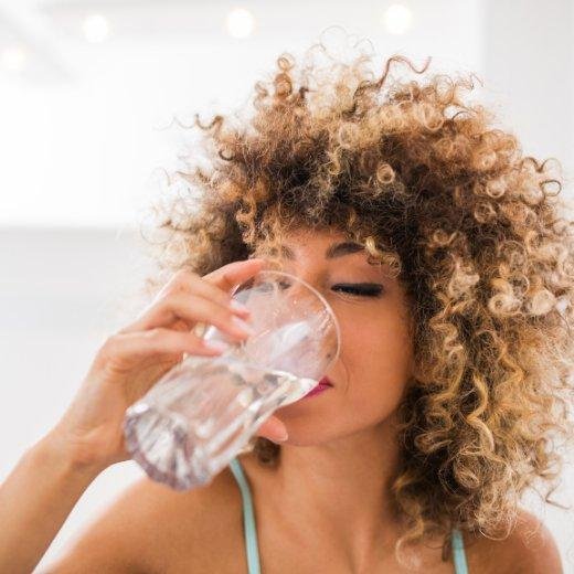 Woman drinking water Woman drinking water