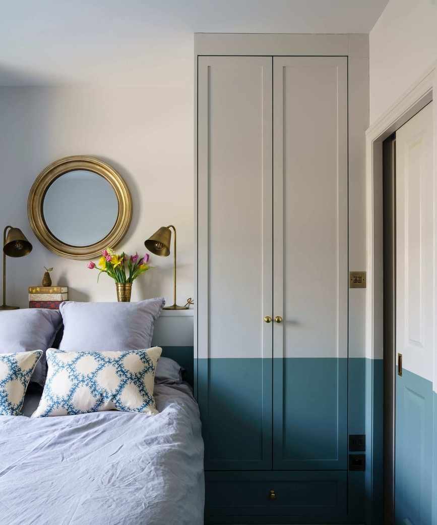 Bedroom with gray and blue walls and wardrobe