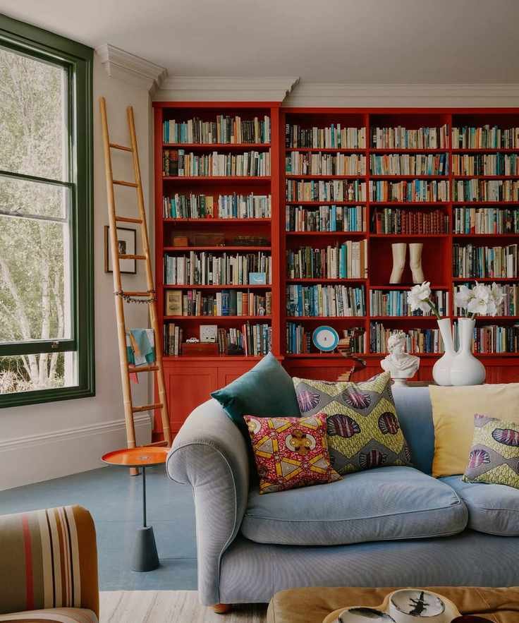 Living room with bright red shelves