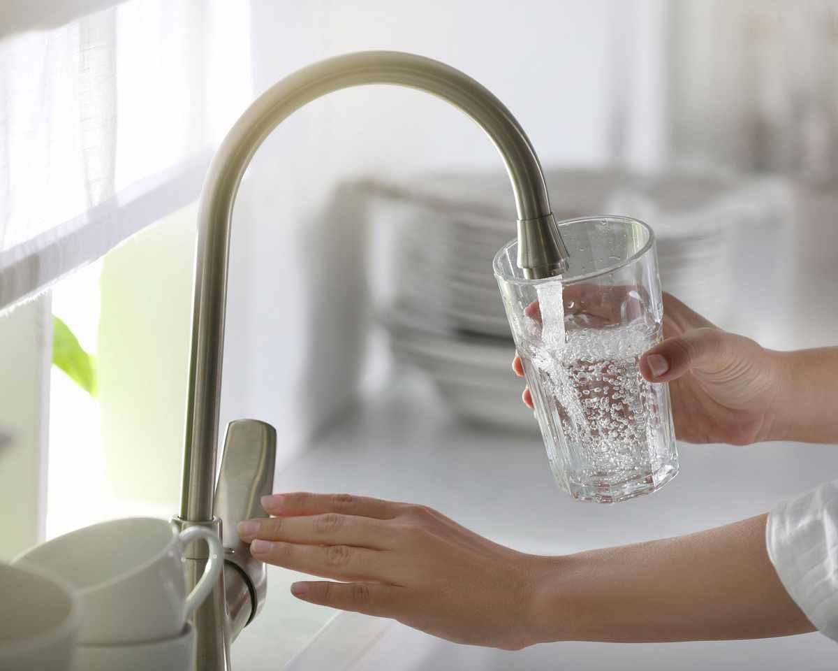 glass of water poured from tap