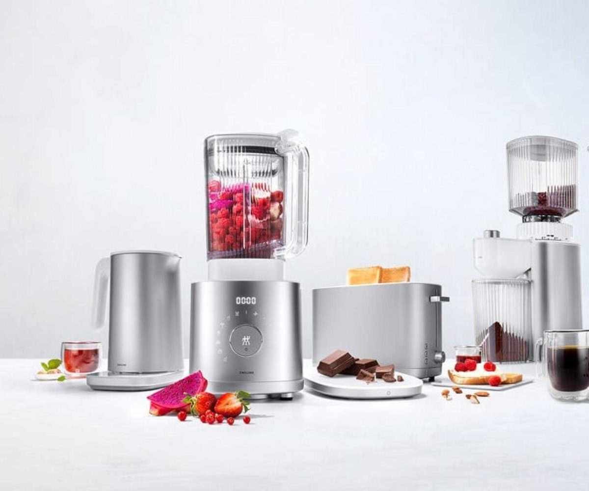 Zwilling Enfinigy range, including the Countertop Blender blending a berry smoothie