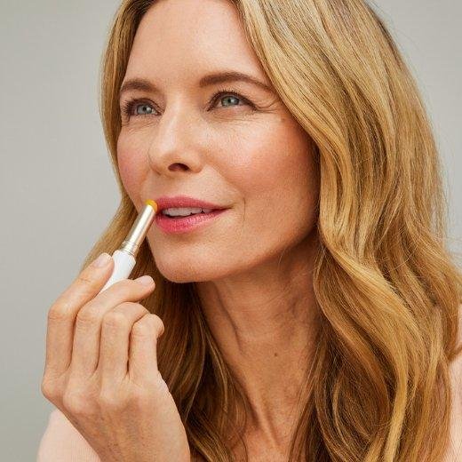 Image of model applying Jane Iredale Just Kissed® Lip and Cheek Stain to their lips