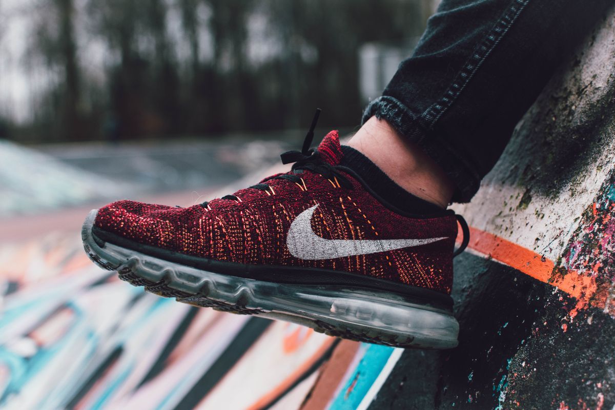 Red Nike Flyknit Air Max running shoe