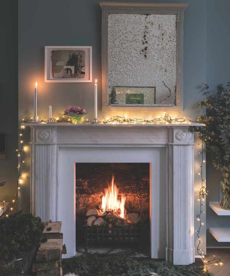 Christmas fireplace decorated with string lights