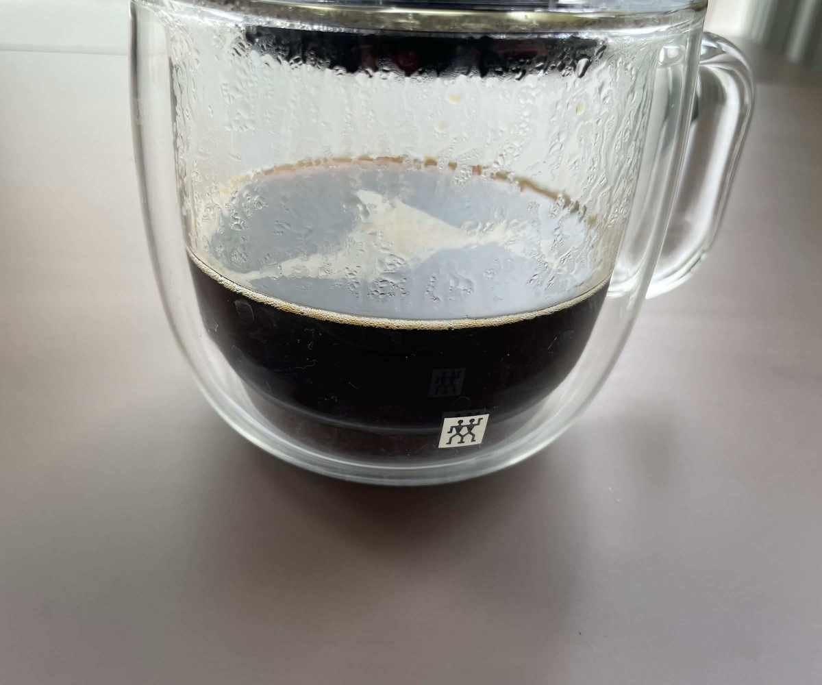 Brewing coffee from the AeroPress into the cup