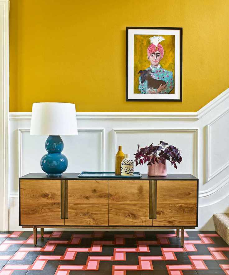 Hallway with yellow walls and contrasting decor