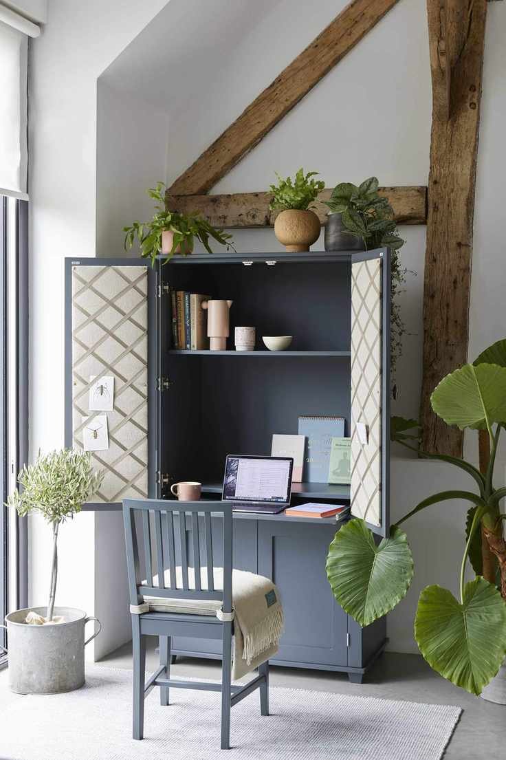 Hidden desks within an armoire