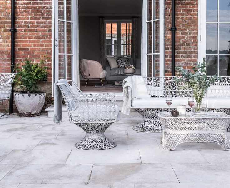 high end natural stone pavers in front of a brick house